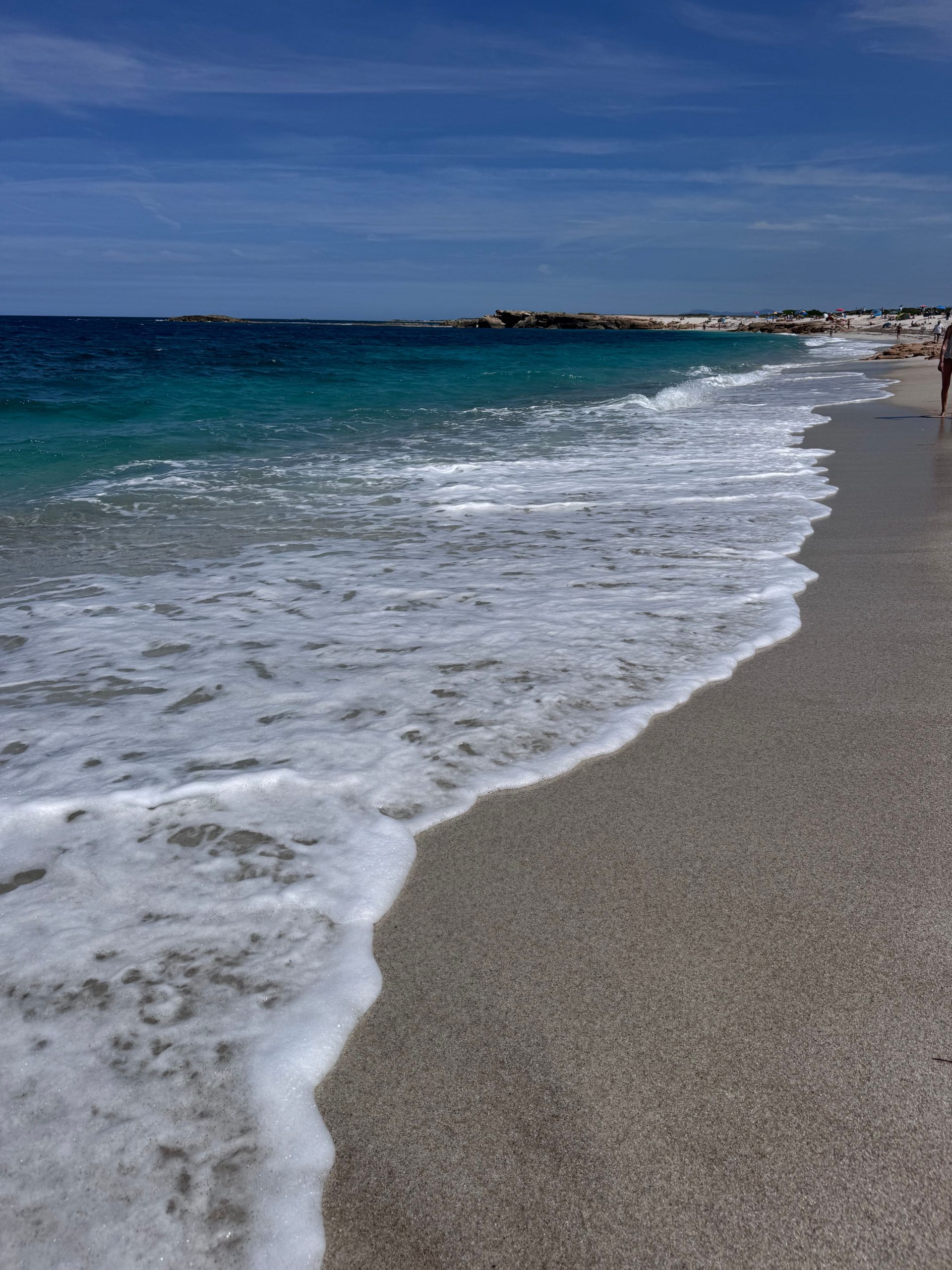 Senior couple walking on the beach together
